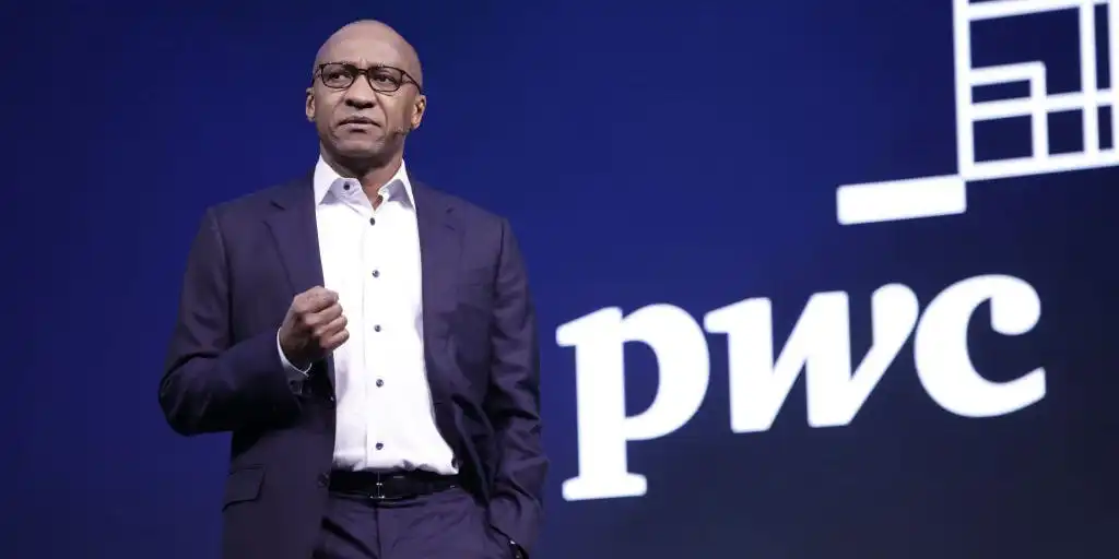 Companies need to expose employees to AI so they start seeing it as a 'digital colleague,' says PwC head
