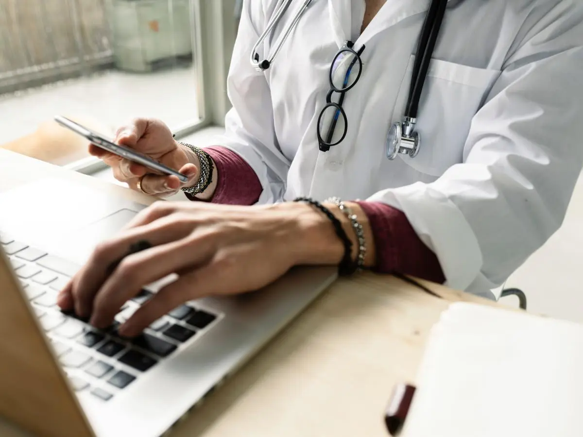 I use an AI assistant as a doctor and cut hours off my workload. But, I'm still cautious about AI's future.